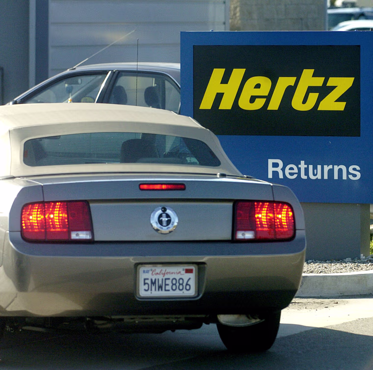 A Ford Mustang is returned to an Oakland, Calif., Hertz location Monday, Sept. 12, 2005. Ford, the nation's second-biggest automaker, said it will sell all shares of common stock in Hertz, its wholly owned subsidiary, to a private equity group composed of Clayton Dubilier & Rice, The Carlyle Group and Merrill Lynch Global Private Equity in a deal valued at about $15 billion, including debt. (AP Photo/Noah Berger)